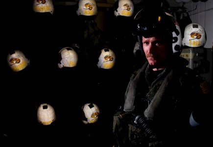 US Navy 111217-N-TZ605-062 Lt. Robert Blackwood, assigned to Strike Fighter Squadron (VFA) 113, poses for a portrait after donning his flight suit