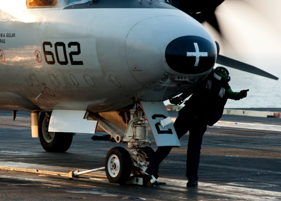 US Navy 111218-N-BT887-057 A Sailor gives the signal to add tension to the catapult to launch an E-2C Hawkeye assigned to the Golden Hawks of Airbo
