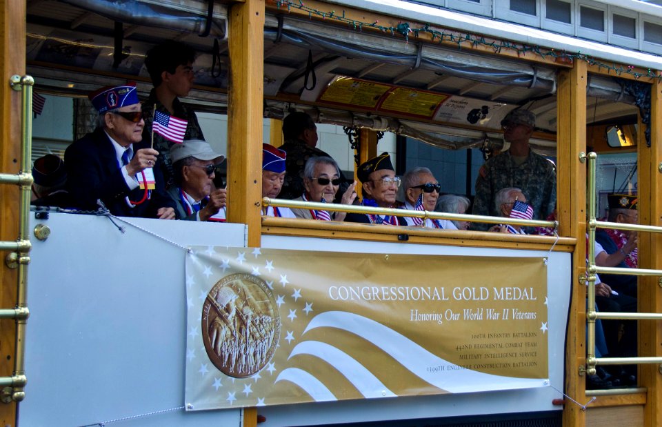 US Navy 111218-N-RI884-050 Japanese-American veterans of World War II, recent recipients of the Congressional Gold Medal, participate in a parade t