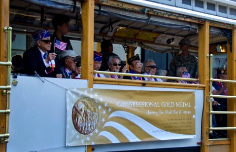US Navy 111218-N-RI884-050 Japanese-American veterans of World War II, recent recipients of the Congressional Gold Medal, participate in a parade t