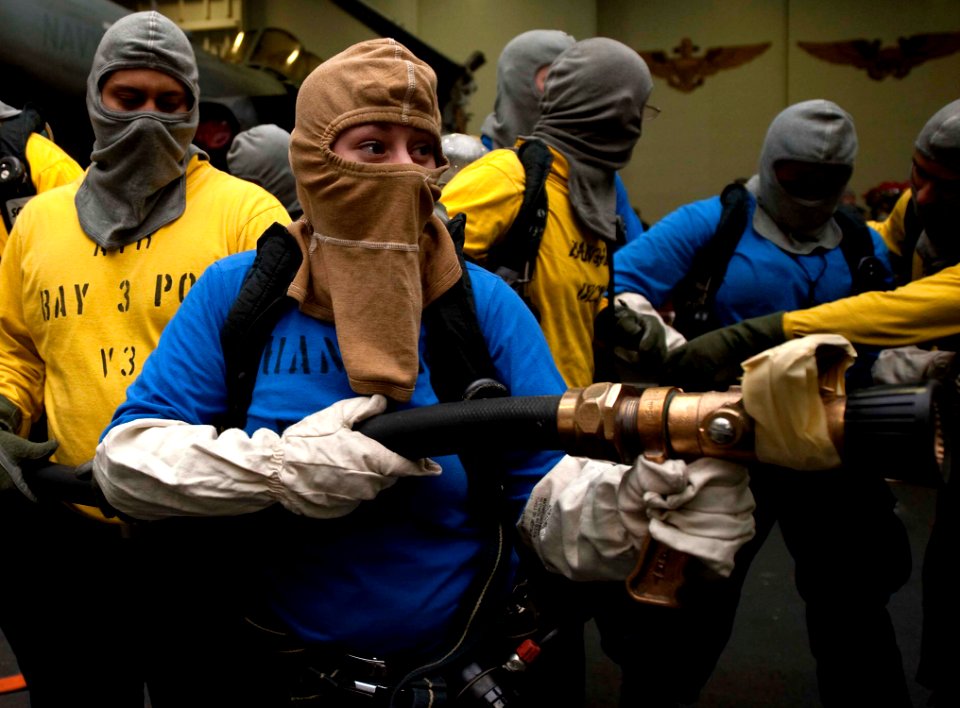 US Navy 111217-N-JN664-036 Airman Apprentice Amber Atkins, assigned to the air department's V-3 division aboard the Nimitz-class aircraft carrier U