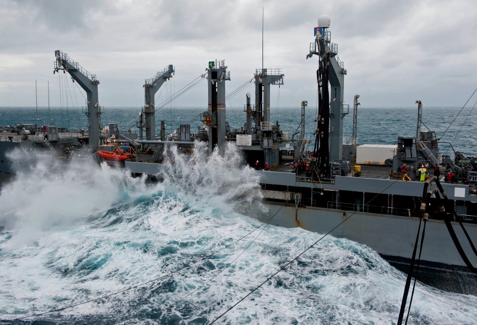US Navy 111220-N-DX615-005 Heavy waves crash against the Military Sealift Command fleet replenishment oiler USNS Tippecanoe (T-AOE 199) during a re