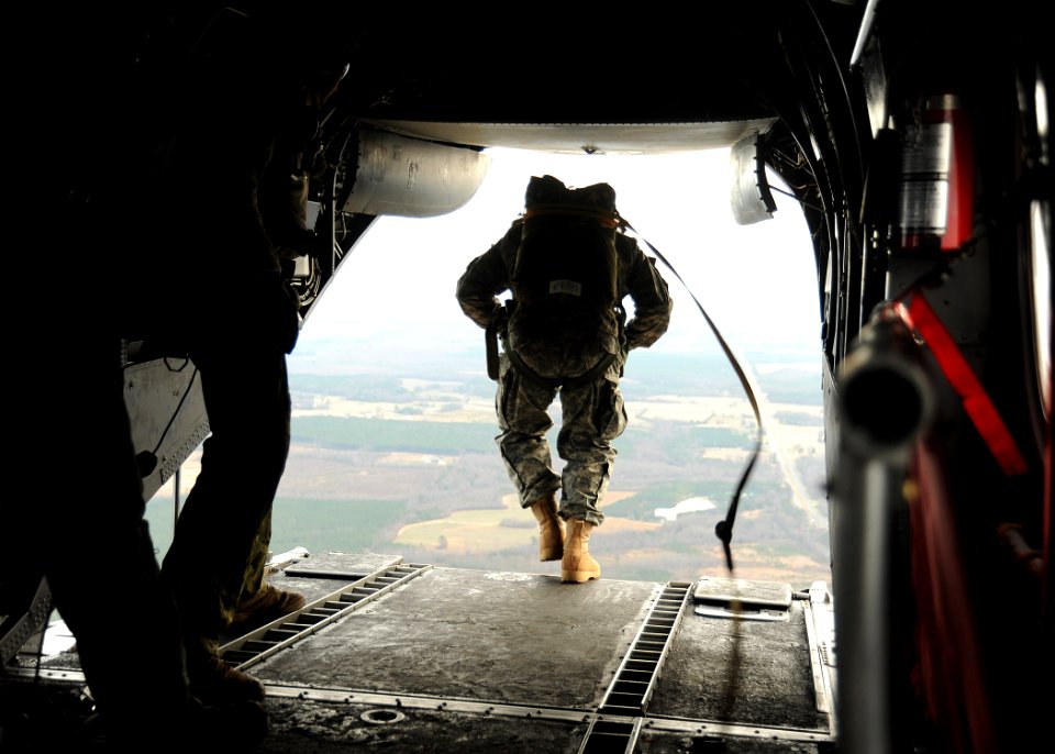 US Navy 111220-N-XX999-168 U.S. Navy SEALs jump from a CH-46E Sea Knight helicopter during training near Fort Pickett