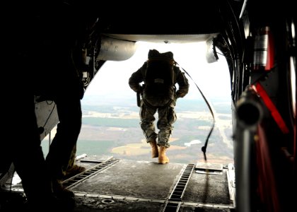 US Navy 111220-N-XX999-168 U.S. Navy SEALs jump from a CH-46E Sea Knight helicopter during training near Fort Pickett