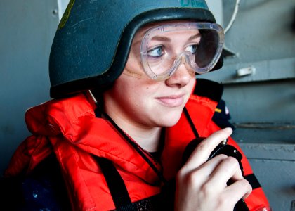 US Navy 111221-N-BT887-178 Seaman Katherine Page, from Dayton, Ohio, uses a sound-powered telephone at a replenishment station aboard the Nimitz-cl