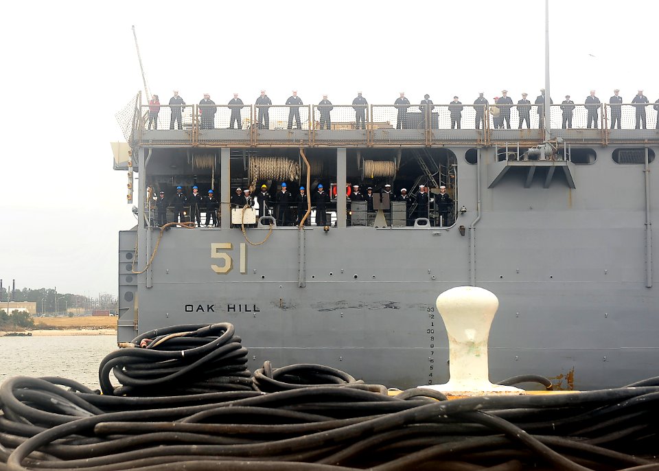 US Navy 111221-N-JP983-005 Sailors assigned to the amphibious dock landing ship USS Oak Hill (LSD 51) man the rails as the ship returns to homeport