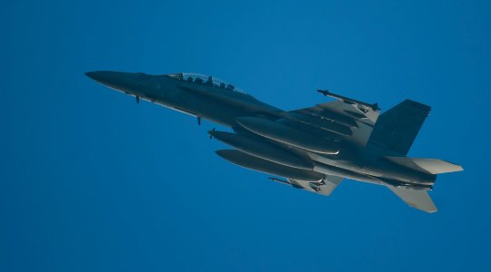 US Navy 111219-N-OY799-084 An F-A-18F Super Hornet from the Black Aces of Strike Fighter Squadron (VFA) 41 performs a flyover over the flight deck
