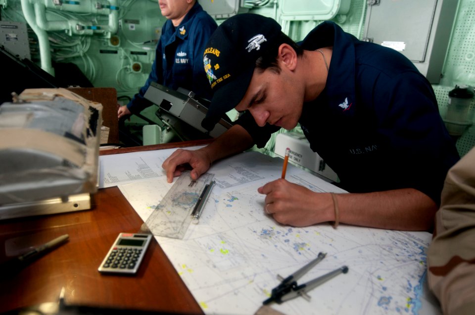 US Navy 111221-N-PB383-041 Quartermaster 3rd Class Matthew Santalucia, assigned to the amphibious transport dock ship USS New Orleans (LPD 18)