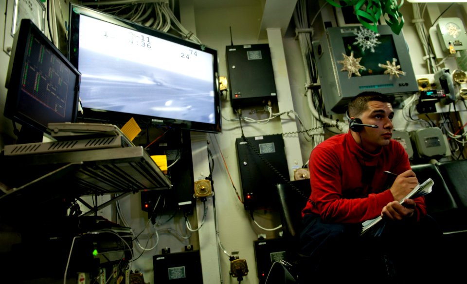 US Navy 111219-N-OY799-198 Aviation Ordnanceman Airman Martin Grujillo, from El Central, Calif., records ordnance carried on aircrafts in flight de