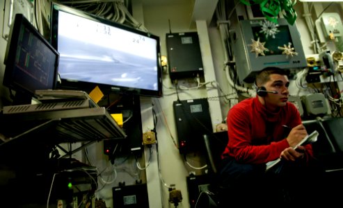 US Navy 111219-N-OY799-198 Aviation Ordnanceman Airman Martin Grujillo, from El Central, Calif., records ordnance carried on aircrafts in flight de
