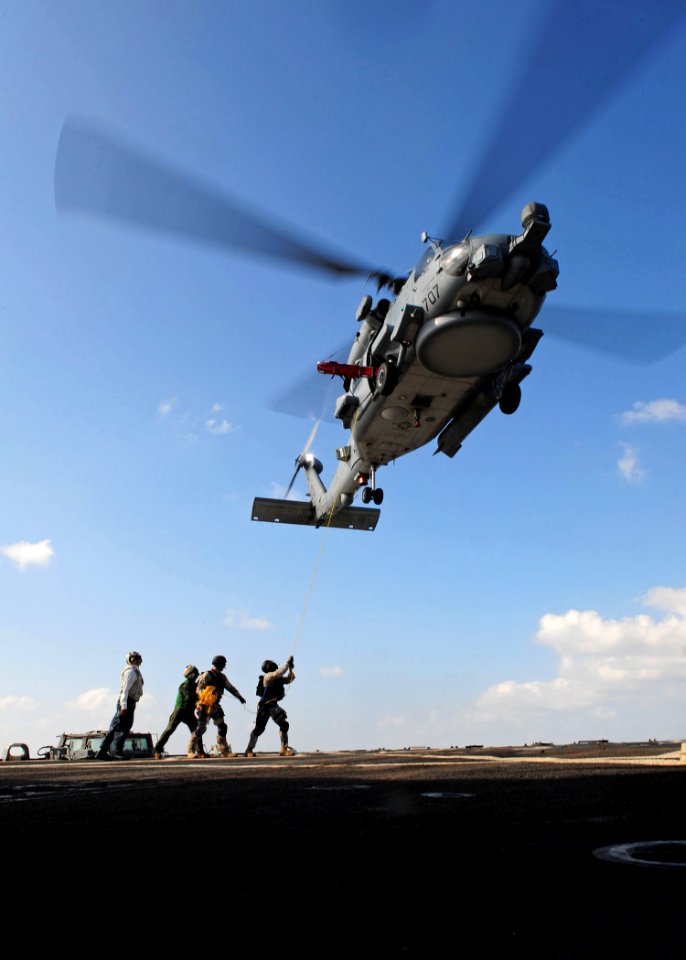 US Navy 111228-N-ED900-290 Members of the visit, board, search and seizure team aboard the guided-missile destroyer USS Pinckney (DDG 91), retrieve