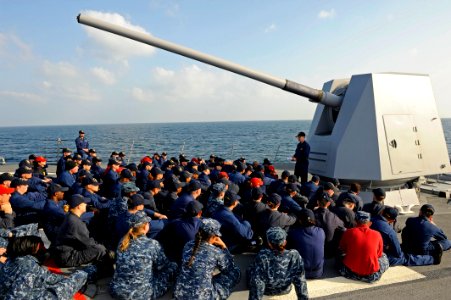 US Navy 111228-N-VH839-049 Cmdr. John Howard, commanding officer of the Arleigh Burke-class guided-missile destroyer USS Dewey (DDG 105), conducts