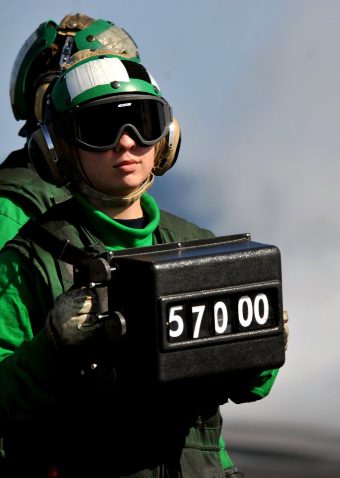 US Navy 120207-N-YB753-015 A Sailor verifies the weight of an aircraft prior to launch