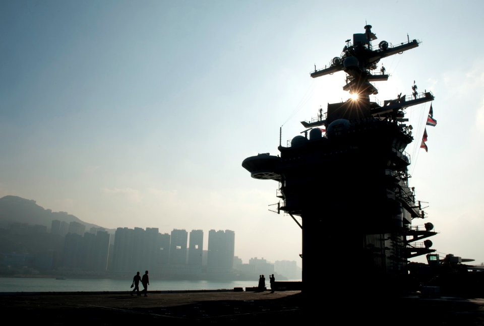 US Navy 111227-N-DR144-213 Sailors transit the flight deck