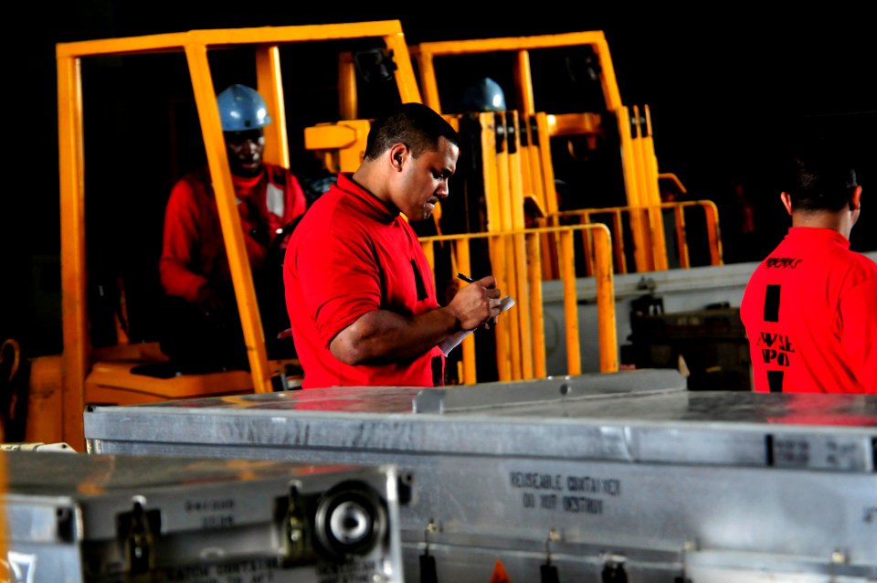 US Navy 111222-N-ZI635-112 Aviation Ordnanceman 2nd Class Soane Sili, assigned to the Nimitz-class aircraft carrier USS Carl Vinson's (CVN 70) weap