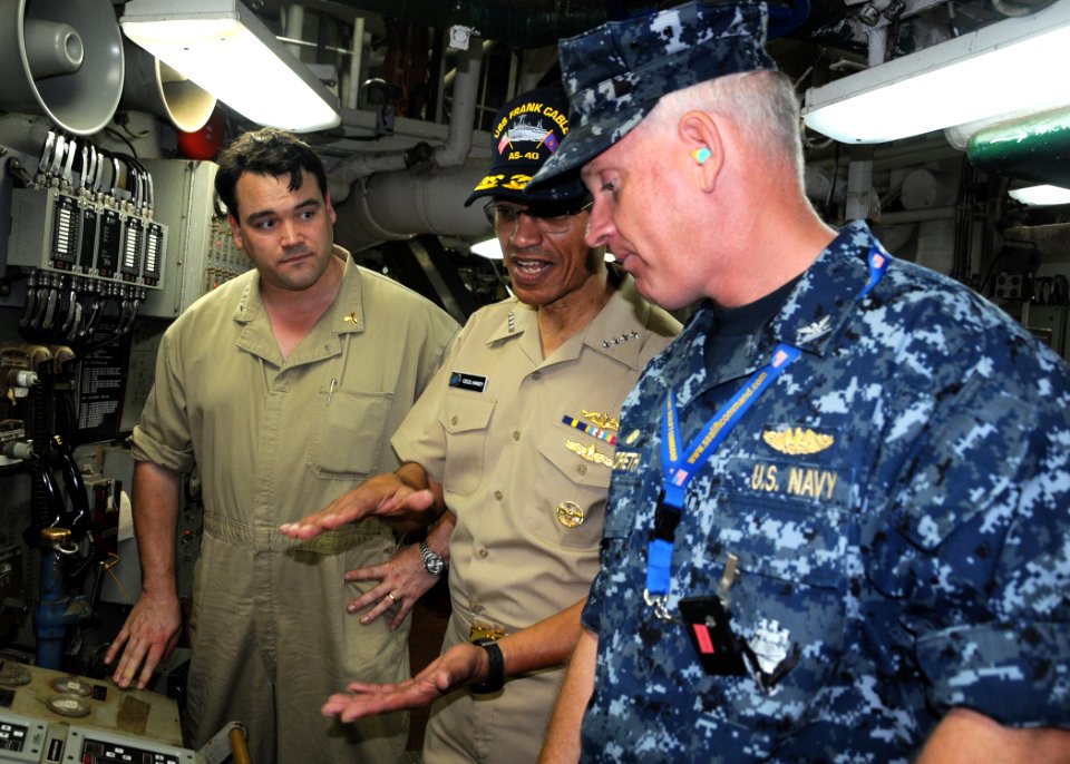 US Navy 120126-N-BK435-036 Adm. Cecil Haney speaks with Capt. Pete Hildreth and David Every of the Military Sealift Command, the ship's chief engin