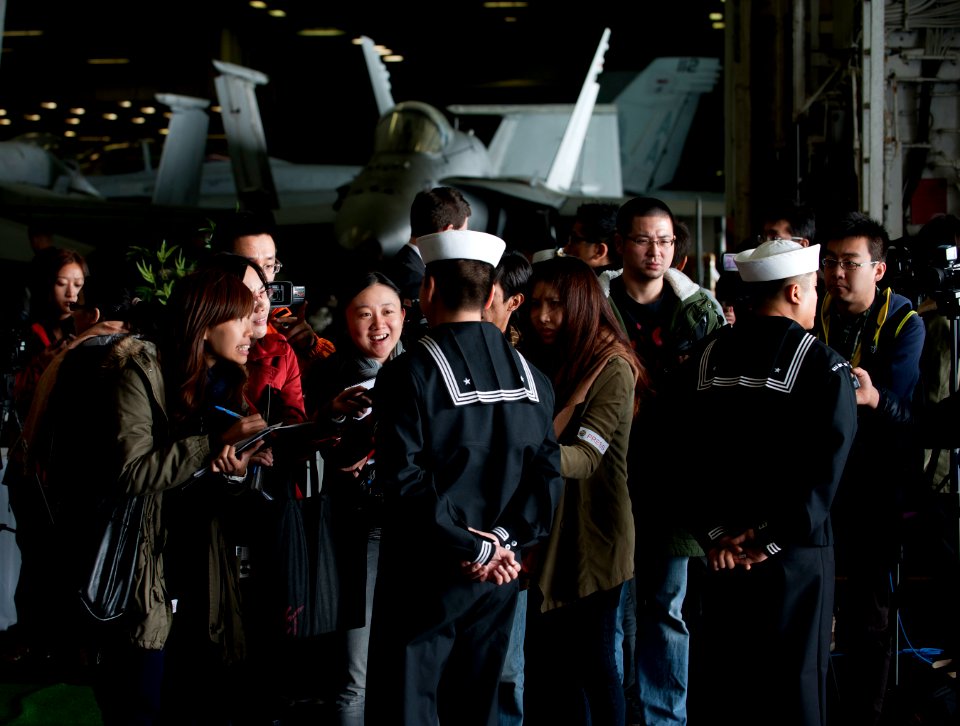 US Navy 111227-N-DR144-474 Sailors speak to the Hong Kong press