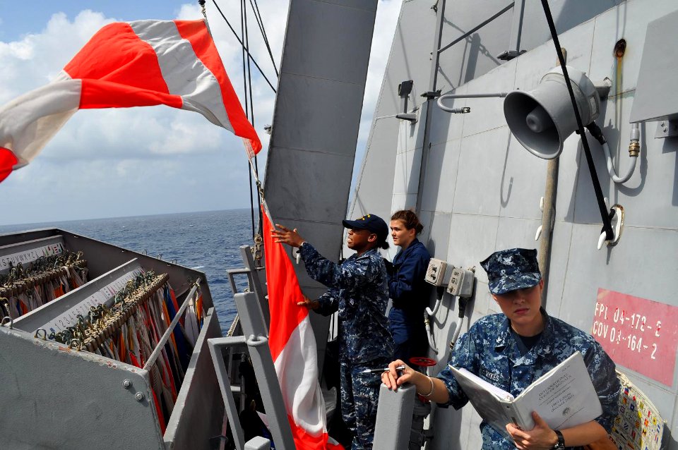 US Navy 120203-N-ZZ999-043 Quartermaster 3rd Class Amanda Shykes, right, and Quartermaster Seamen Elora Presseau and Neisha Kirkling participate in