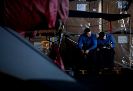 US Navy 111223-N-DR144-152 Airman Michael Laurion, right, and Airman Dylan Ulrich, both assigned to the Nimitz-class aircraft carrier USS Carl Vins