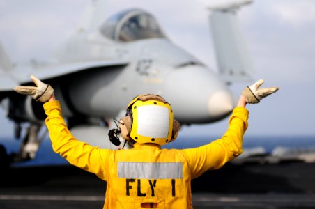 US Navy 111231-N-GZ832-582 Aviation Boatswain's Mate (Handling) 3rd Class Alexis Lebrake, assigned to the air department aboard the aircraft carrie