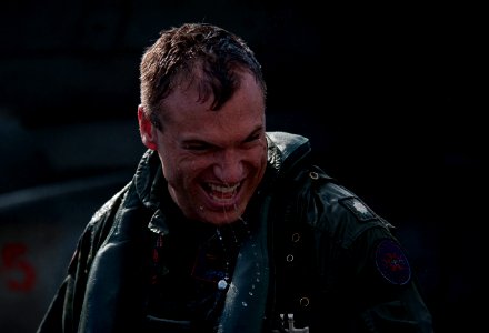 US Navy 111222-N-DR144-420 Cmdr. John Boone, commanding officer of Strike Fighter Squadron (VFA) 81, laughs as he is hosed down by his squadron mat
