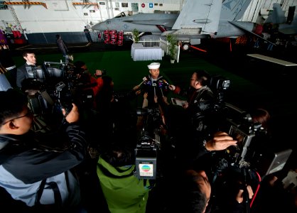 US Navy 111227-N-DR144-569 A Sailor speaks to members of the Hong Kong press.