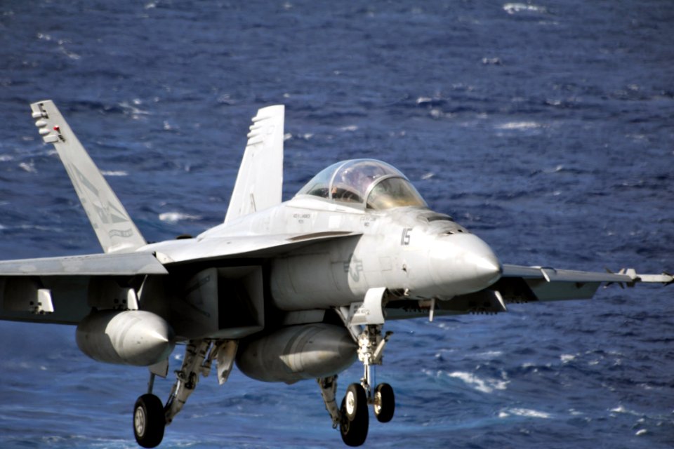 US Navy 111224-N-YB753-040 Jet approaches the flight deck of USS Abraham Lincoln