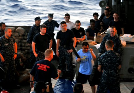 US Navy 111229-N-YB753-020 Aviation Boatswain's Mate (Handling) 1st Class Eric Ruiz demonstrates basic armed sentry skills during an oleoresin caps