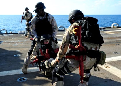 US Navy 111228-N-ED900-039 Members of the visit, board, search and seizure team aboard the guided-missile destroyer USS Pinckney (DDG 91) carry a S
