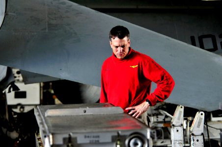 US Navy 111222-N-ZI635-129 Cmdr. Paul C. Spedero, executive officer of the Nimitz-class aircraft carrier USS Carl Vinson (CVN 70) inspects ordnance