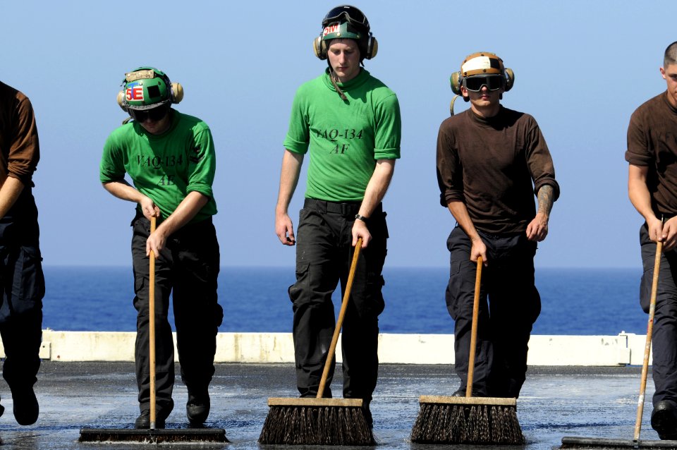 US Navy 111223-N-RG587-545 Sailors scrub the flight deck of the Nimitz-class aircraft carrier USS Carl Vinson (CVN 70)