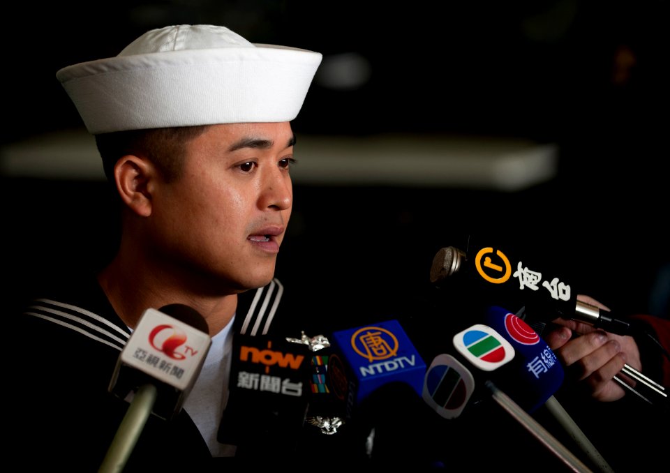 US Navy 111227-N-DR144-613 A Sailor speaks to members of the Hong Kong press