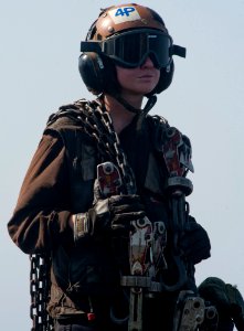 US Navy 120104-N-OY799-085 Airman Elaina Ketola observes flight operations on the flight deck of the Nimitz-class aircraft carrier USS John C. Sten