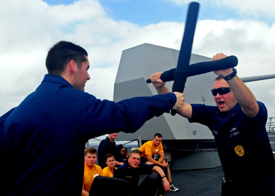 US Navy 111231-N-ZF681-127 Sailors practice crowd control tactics during combat training aboard the guided-missile destroyer USS Halsey (DDG 97)
