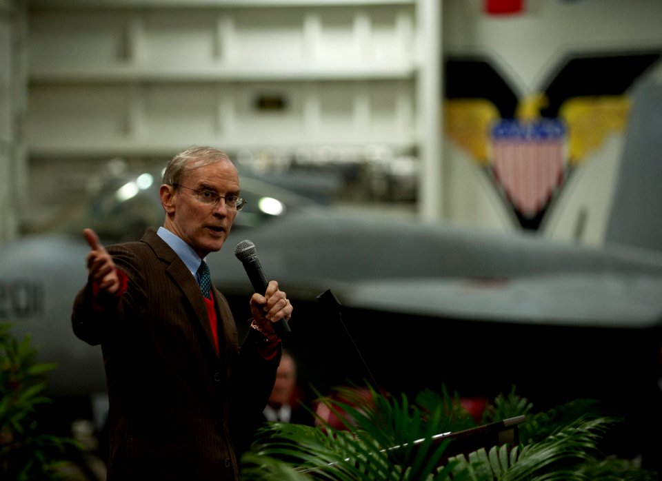 US Navy 111227-N-DR144-836 Ambassador Stephen Young delivers remarks during a reception for Hong Kong guests in the hangar bay aboard the Nimitz-cl