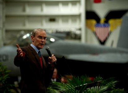 US Navy 111227-N-DR144-836 Ambassador Stephen Young delivers remarks during a reception for Hong Kong guests in the hangar bay aboard the Nimitz-cl