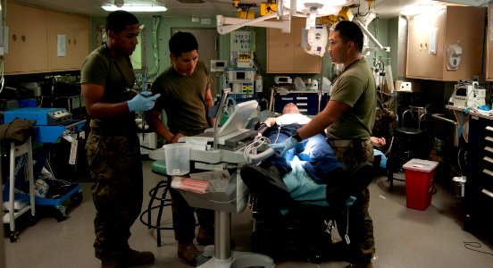 US Navy 111230-N-PB383-098 Hospital corpsmen address simulated casualties during a total ship survivability exercise aboard the amphibious transpor