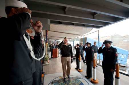 US Navy 120104-N-CZ945-004 Rear Adm. Mark L. Tidd, Chaplain Corps chief of the Navy Chaplains, passes through sideboys aboard the U.S. 7th Fleet fl