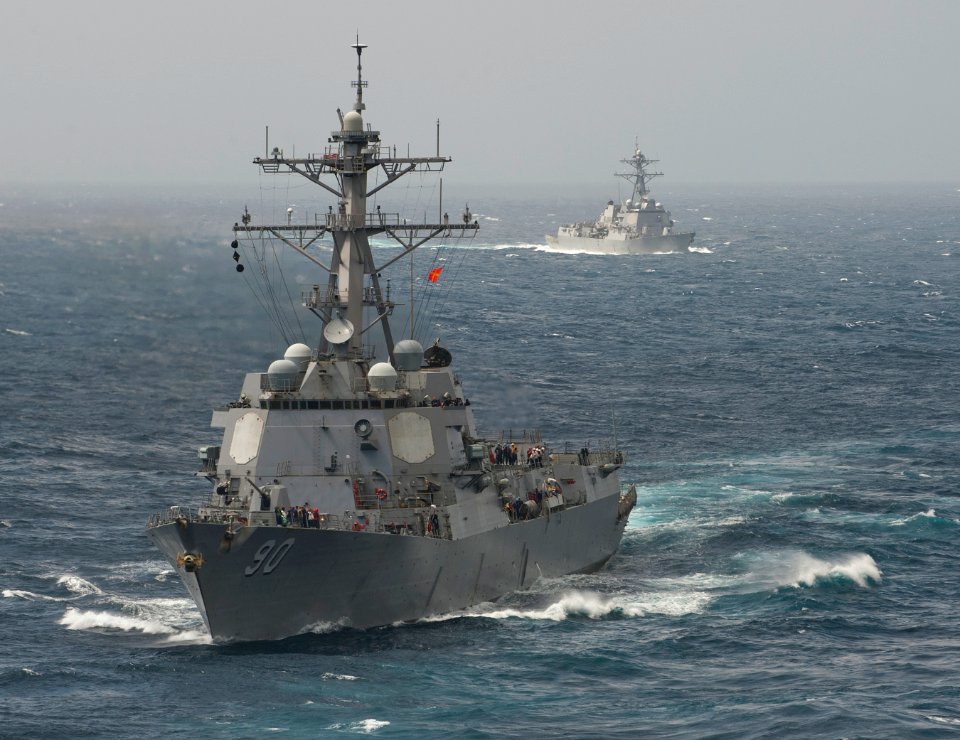 US Navy 120102-N-DR144-221 Ships maneuver behind USS Carl Vinson during a replenishment at sea