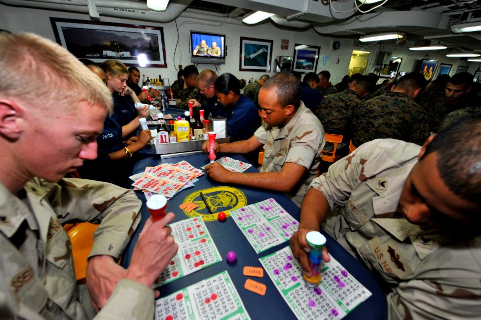 US Navy 111231-N-KS651-426 Marines assigned to the 11th Marine Expeditionary Unit (11th MEU) and Sailors celebrate New Year's Eve by playing bingo