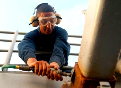 US Navy 120103-N-VY256-026 Boatswain's Mate Seaman Recruit Cambren Oliver, assigned to the Ticonderoga-class guided-missile cruiser USS Cape St. Ge