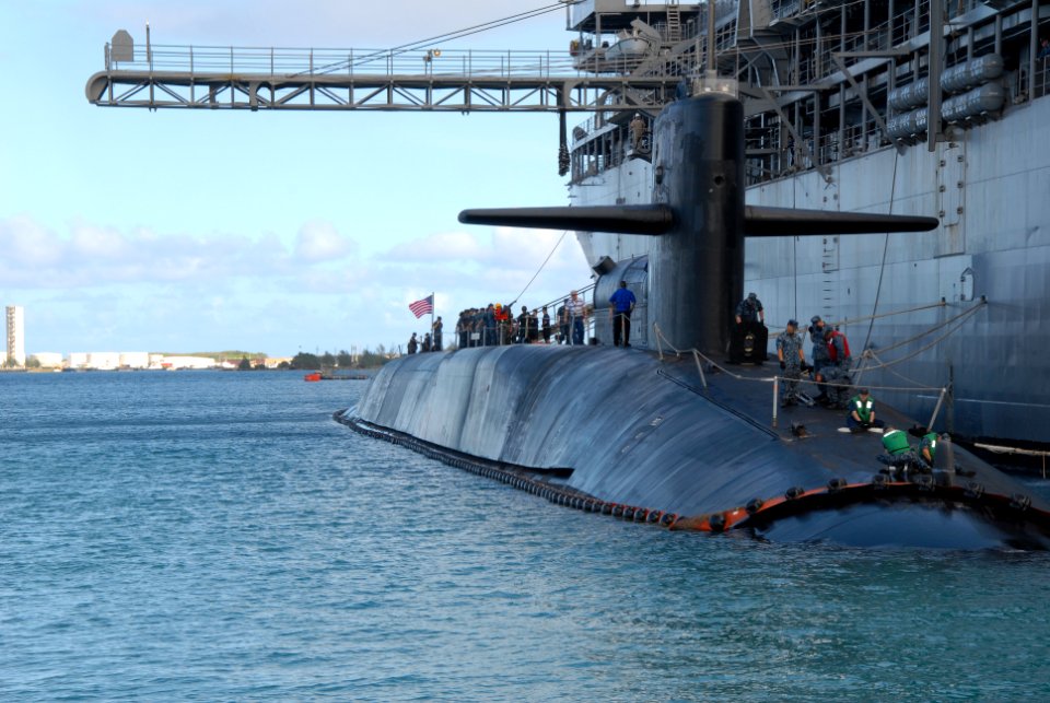 US Navy 120103-N-CO162-169 The Ohio-class guided-missile submarine USS Michigan (SSGN 727) pulls alongside of the submarine tender USS Frank Cable