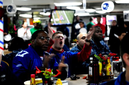 US Navy 120206-N-MD252-463 Sailors watch Super Bowl XLVI aboard the Nimitz-class aircraft carrier USS Carl Vinson (CVN 70)