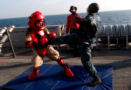 US Navy 120105-N-PB383-685 A Sailor defends against a simulated attacker after being sprayed with oleoresin capsicum