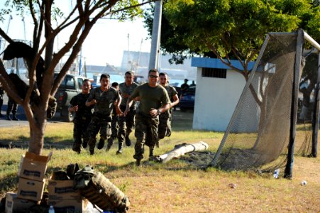 US Navy 120106-N-MN502-151 Gunnery Sgt. Edward Palacios, assigned to the Marine detachment aboard High Speed Vessel (HSV 2) Swift, races a group of