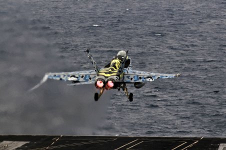 US Navy 120103-N-ZI635-042 An F-A-18C Hornet, assigned to Strike Fighter Squadron (VFA) 113, launches from the flight deck of the Nimitz-class airc
