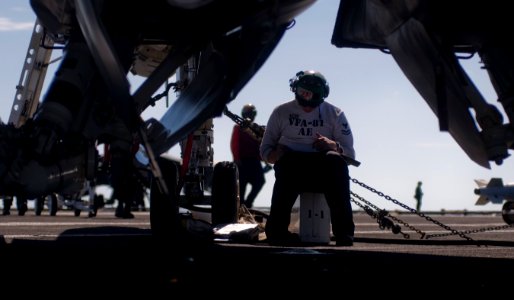 US Navy 120107-N-TZ605-256 Aviation Electrician's Mate 2nd Class Jason Favor, assigned to Strike Fighter Squadron (VFA) 81, performs maintenance on