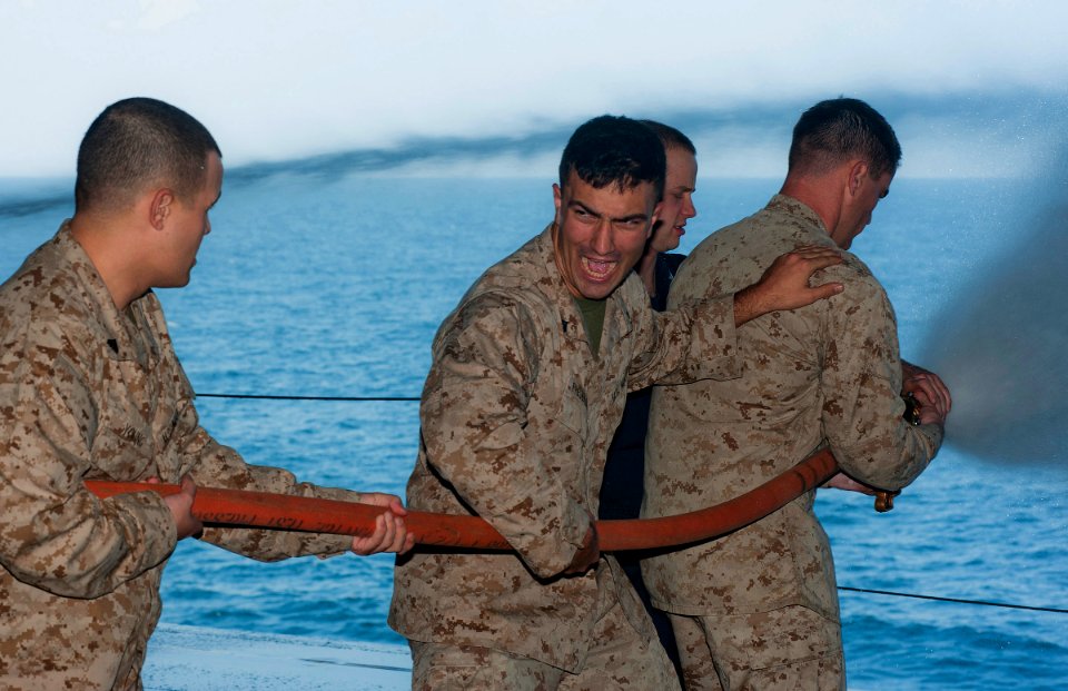 US Navy 120104-N-DX615-079 Marines practice proper hose handling techniques