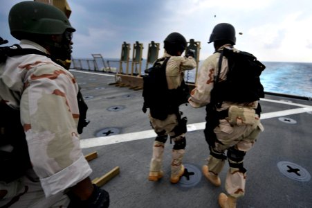 US Navy 120101-N-KS651-464 Members of the visit, board, search and seizure team aboard the amphibious dock landing ship USS Pearl Harbor (LSD 52) photo