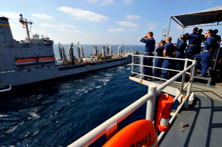 US Navy 120104-N-KS651-067 Sailors stand watch on the bridge wing of amphibious dock landing ship USS Pearl Harbor (LSD 52) during a replenishment